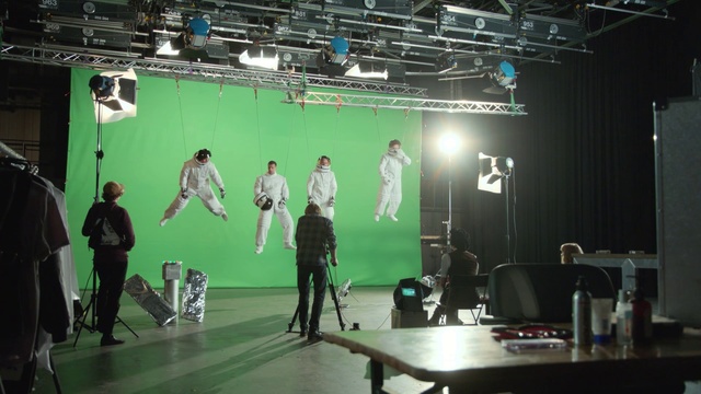 Video Reference: Green, Stage, Film studio, Performance, Fashion, Stage equipment, Technology, Electronics, Design, Event, Person