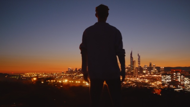 Video Reference: sky, sunset, sunrise, male, evening, city, standing, horizon, morning, night