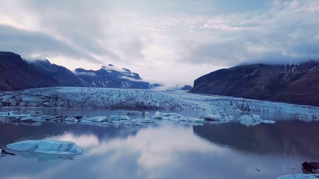 Video Reference: Body of water, Polar ice cap, Iceberg, Glacial lake, Nature, Glacial landform, Ice, Natural landscape, Glacier, Arctic ocean