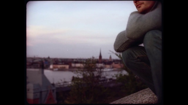 Video Reference: Photograph, Sky, Snapshot, Photography, Horizon, Morning, Reflection, Fun, Window, Cloud, Person, Outdoor, Man, Holding, Standing, Looking, Water, Front, Wearing, Board, Young, Shirt, Bench, Woman, Hat, Ocean, White, Winter, Clothing