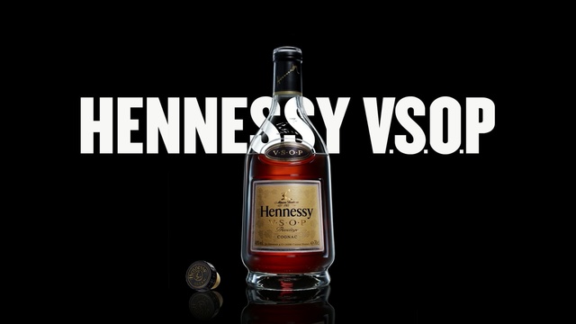 Video Reference: liqueur, distilled beverage, drink, alcoholic beverage, product, bottle, glass bottle, alcohol, whisky, product, Person