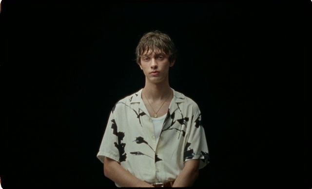 Video Reference: Photograph, Black, Facial expression, Arm, Music, Sitting, Fun, Chin, Portrait, Human