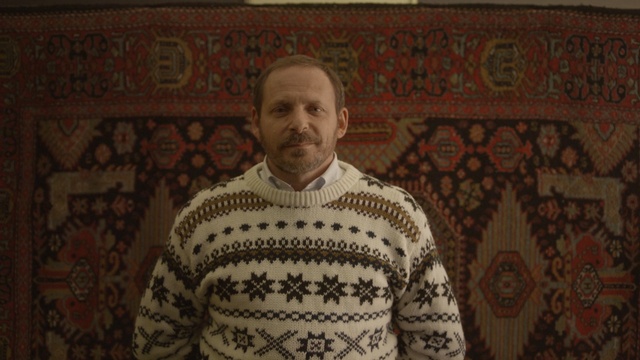 Video Reference: textile, facial hair, material, pattern, art, Person