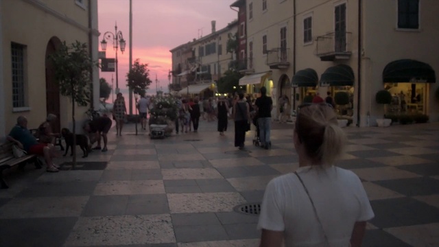 Video Reference: Town, Street, Pedestrian, Neighbourhood, Human settlement, Public space, City, Snapshot, Road, Downtown