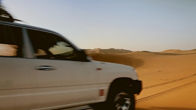 Video Reference: desert, aeolian landform, motor vehicle, sand, mode of transport, landscape, vehicle, transport, road, off roading
