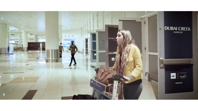 Video Reference: Snapshot, Shoulder, Human, Footwear, Beige, Outerwear, Street fashion, Baggage, Shoe, Luggage and bags