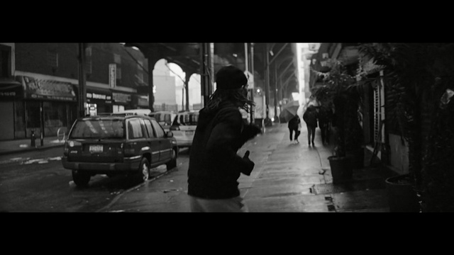 Video Reference: black, photograph, urban area, black and white, street, monochrome photography, road, darkness, infrastructure, mode of transport, Person