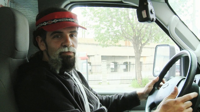 Video Reference: car, motor vehicle, vehicle, mode of transport, facial hair, vehicle door, technology, automotive design, beard, city car, Person