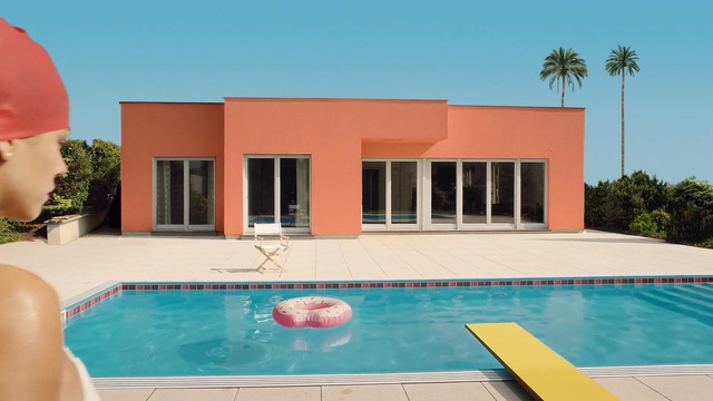 Video Reference: resort hotel, villa, resort, water, vacation, pool, hotel, travel, swimming, sky, summer, building, Person