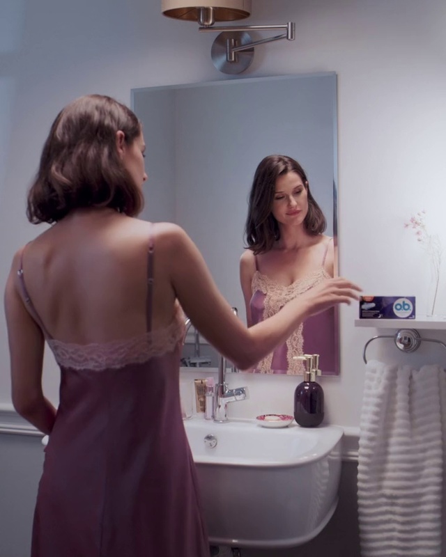 Video Reference: Purple, Shoulder, Dress, Bathroom, Beauty, Room, Material property, Hand, Plumbing fixture, Interior design