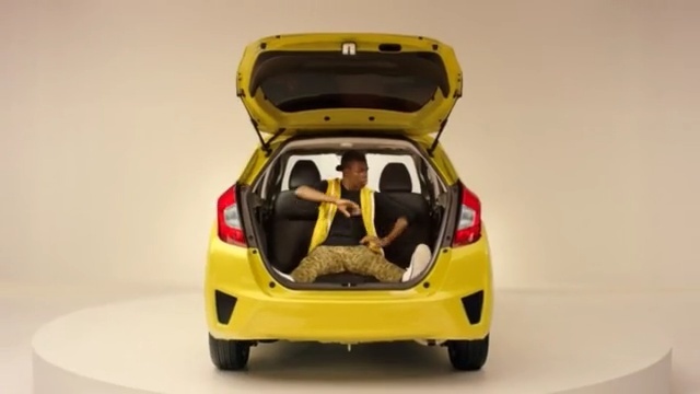 Video Reference: car, motor vehicle, vehicle, yellow, automotive design, vehicle door, mode of transport, auto show, city car, automotive exterior, Person
