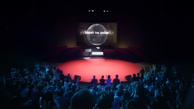 Video Reference: stage, entertainment, theatre, auditorium, theatre, audience, event, darkness, theatrical scenery, concert, Person