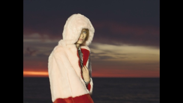Video Reference: sky, outerwear, religion, fun, fur, girl