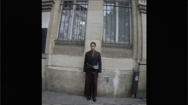 Video Reference: Photograph, Standing, Snapshot, Architecture, Column, Outerwear, Suit, Temple, Photography, Formal wear