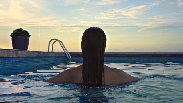 Video Reference: Water, Sky, Marine mammal, Leisure, Sea, Swimming pool, Vacation, Long hair, Ocean, Cetacea, Person