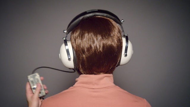 Video Reference: headphones, electronic device, audio equipment, technology, audio, chin, microphone, hearing, ear, neck, Person