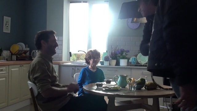 Video Reference: room, conversation, interior design, window, table, electronic device, Person