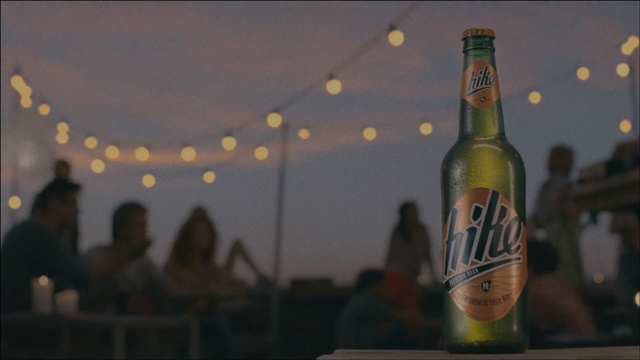 Video Reference: beer bottle, bottle, vessel, container, alcohol, drink, glass, beverage, pop bottle, lager, liquid, party, beer