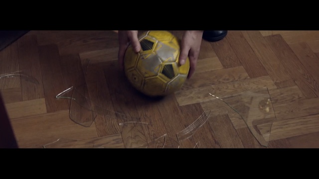 Video Reference: Ball, Soccer ball, Yellow, Football, Hardwood, Floor, Flooring, Wood, Headgear, Personal protective equipment