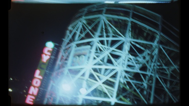 Video Reference: ferris wheel, tourist attraction, light, structure, night, daylighting, recreation, space, darkness, world