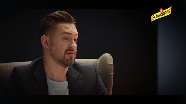 Video Reference: Cheek, Chin, Forehead, Gentleman, Arm, Muscle, Neck, Ear, Jaw, Facial hair, Person, Man, Indoor, Looking, Front, Laptop, Sitting, Suit, Screen, Computer, Table, Wearing, Holding, Standing, Television, Young, Sign, White, Screenshot, Human face, Text, Clothing, Face, Portrait