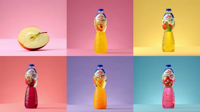 Video Reference: Orange, Bottle, Plastic bottle, Non-alcoholic beverage, Orange soft drink, Orange drink, Drink, Soft drink, Glass bottle, Water bottle, Person, Indoor, Different, Photo, Table, Standing, Pink, Refrigerator, Colorful, Food, Dog, Water, Doughnut, Various, Sitting, Colored, Bedroom, Group, Computer, Desk, Many, Room, Hot, Man, Art, Toy