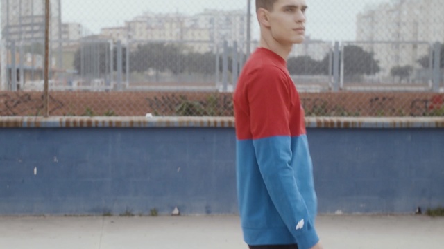 Video Reference: Standing, Street fashion, Electric blue, Joint, T-shirt, Outerwear, Neck, Denim, Sleeve, Shoe, Person