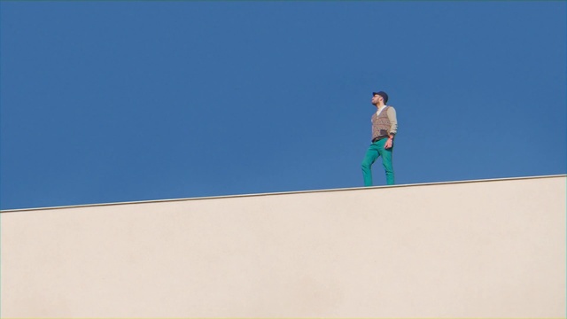 Video Reference: Blue, Daytime, Azure, Sand, Sky, Line, Outdoor, Man, Board, Riding, Snow, Game, Skiing, Standing, Slope, Bird, Water, Hill, White, Jumping, Air, Table, Ramp, Sign, Court, Person, Text, Footwear