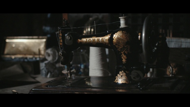 Video Reference: sewing machine, textile machine, home appliance, appliance, machine, durables, device, consumer goods, Person