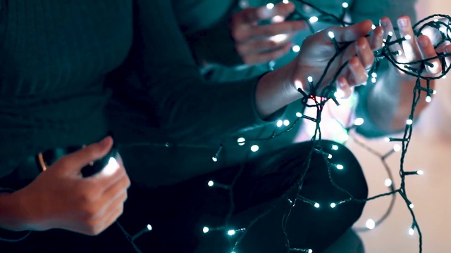 Video Reference: Blue, Performance, Musician, Music, Music artist, Light, Microphone, Hand, Event, Stage, Indoor, Person, Sitting, Table, Holding, Looking, Glasses, Using, Computer, Glass, Black, Woman, Pair, Lit, Desk, Phone, Room, Man, Standing, Red, Concert, Band