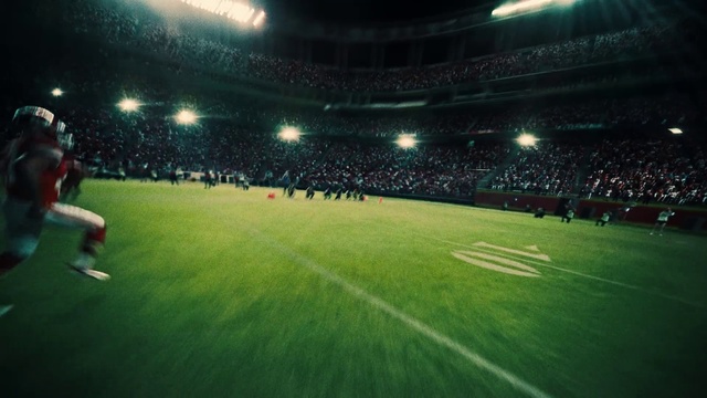Video Reference: Sport venue, Stadium, Soccer-specific stadium, Arena, Football, Atmosphere, Player, Football player, Team sport, Ball game, Grass, Building, Man, Ball, Game, Front, Playing, Dark, Holding, Night, Baseball, Field, Standing, Green, Large, Swinging, People, Bat, White, Red, Room, Air, Group, Court, Soccer