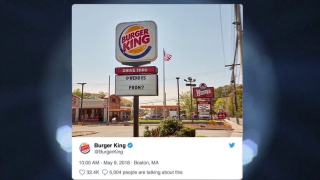 Video Reference: Advertising, Display advertising, Billboard, Signage, Font, Fast food restaurant, Brand, Sign, Logo, Building