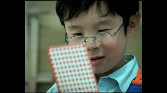 Video Reference: face, facial expression, glasses, nose, vision care, head, child, chin, eyewear, cheek, Person