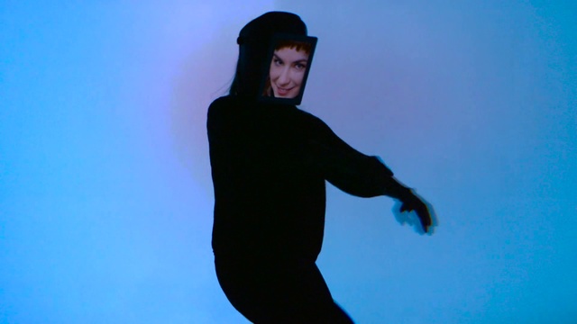 Video Reference: Blue, Standing, Arm, Silhouette, Finger, Electric blue, Hand, Neck, Shadow, Sleeve