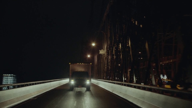 Video Reference: Night, Light, Darkness, Lighting, Street light, Road, Metropolitan area, Sky, Mode of transport, Architecture