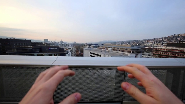 Video Reference: Hand, Sky, Technology, Electronic device, Finger, Electronics, Gadget, Gesture, City