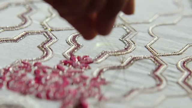 Video Reference: pink, jewellery, needlework, chain, lace, Person
