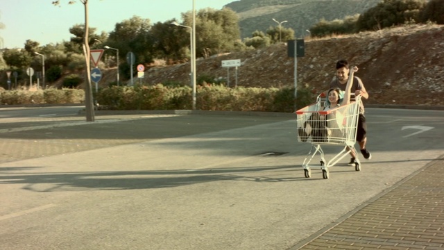 Video Reference: Product, Mode of transport, Asphalt, Vehicle, Road, Cart, Walking, Photography, Road surface, Street