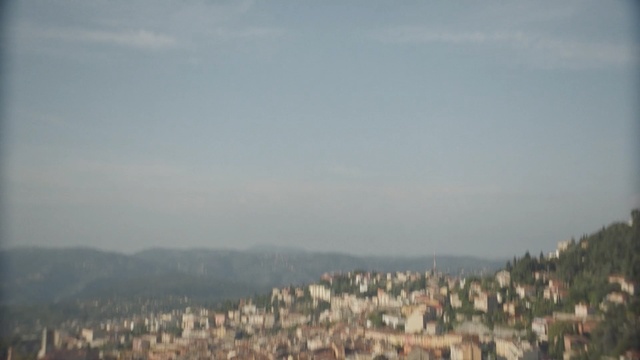 Video Reference: sky, cloud, tree, daytime, horizon, atmosphere, hill station, mountain, haze, hill