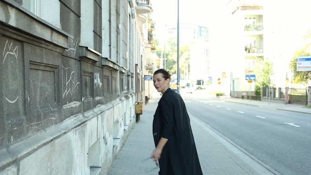 Video Reference: Photograph, Street fashion, Snapshot, Street, Standing, Road, Infrastructure, Urban area, Fashion, Outerwear, Person