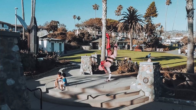 Video Reference: tree, recreation, vehicle, city, outdoor structure, plaza