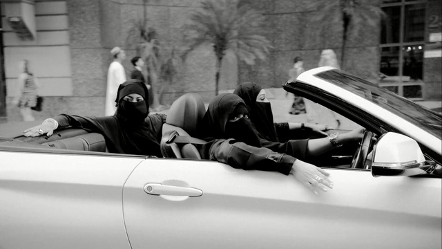 Video Reference: White, Black, Vehicle, Vehicle door, Motor vehicle, Car, Snapshot, Automotive design, Black-and-white, Person