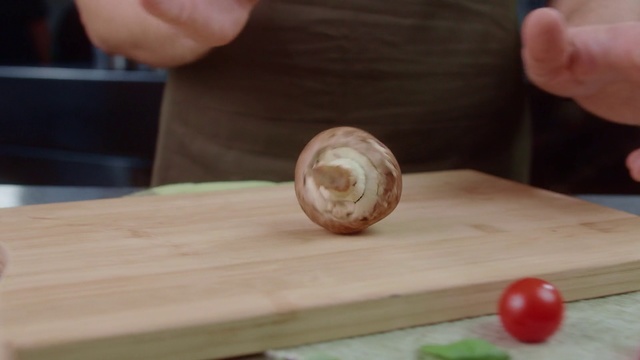 Video Reference: Wood, Cutting board, Hand, Food, Finger, Table, Dish, Bivalve