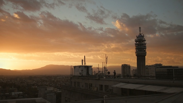 Video Reference: Sky, Cloud, Afterglow, Sunset, Morning, Atmospheric phenomenon, Evening, Daytime, Dusk, City, Person