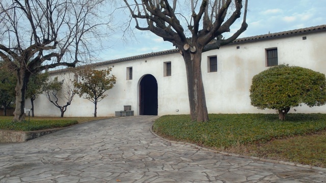 Video Reference: property, estate, building, wall, tree, courtyard, hacienda, villa, real estate, home, Person