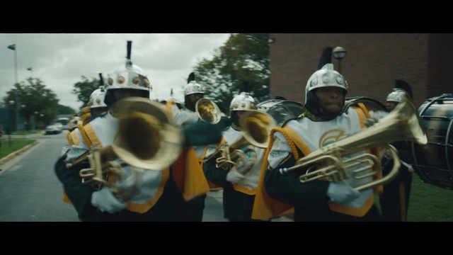 Video Reference: brass instrument, wind instrument, musical instrument, musician, mellophone, tuba, musical ensemble, trumpet, horn, skin head percussion instrument