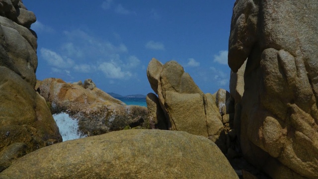 Video Reference: rock, boulder, sky, formation, bedrock, outcrop, terrain, cliff, geology, mountain, Person