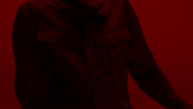 Video Reference: Red, Black, Orange, Maroon, Outerwear, Darkness, Jacket, Sleeve, Brown, Room