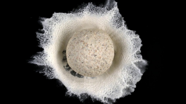 Video Reference: , Indoor, Doughnut, Dark, Looking, Sitting, Donut, Table, White, Food, Cake, Face, Man, Sugar, Water, Holding, Laying