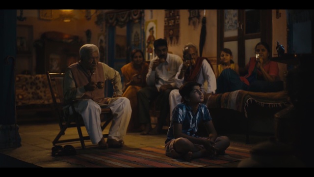 Video Reference: Adaptation, Sitting, Scene, Music, Conversation, Person